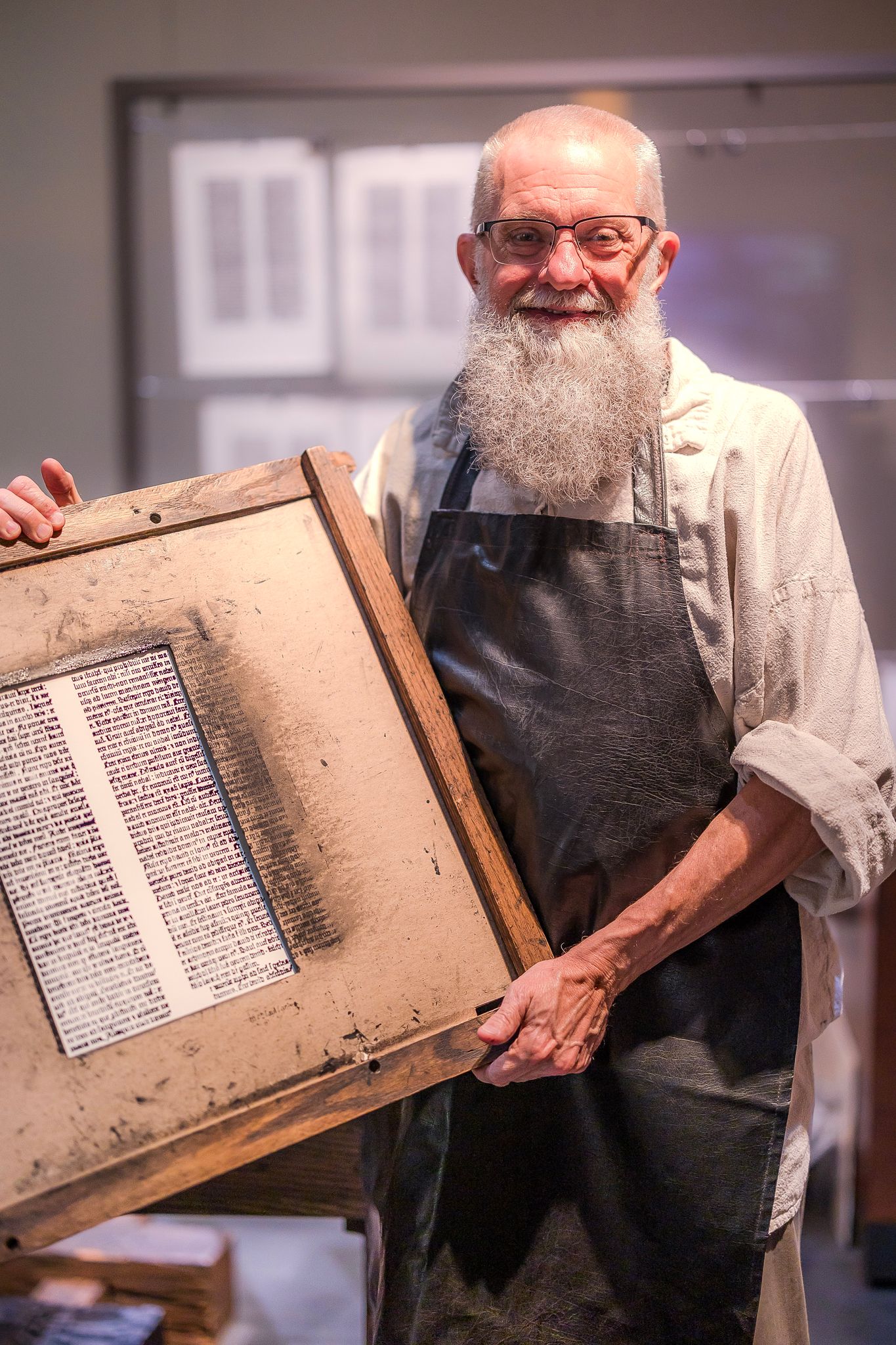 A demonstrator of The Gutenberg Press shows off his work. The press is on exhibit at the Museum of the Bible in Washington, D.C.