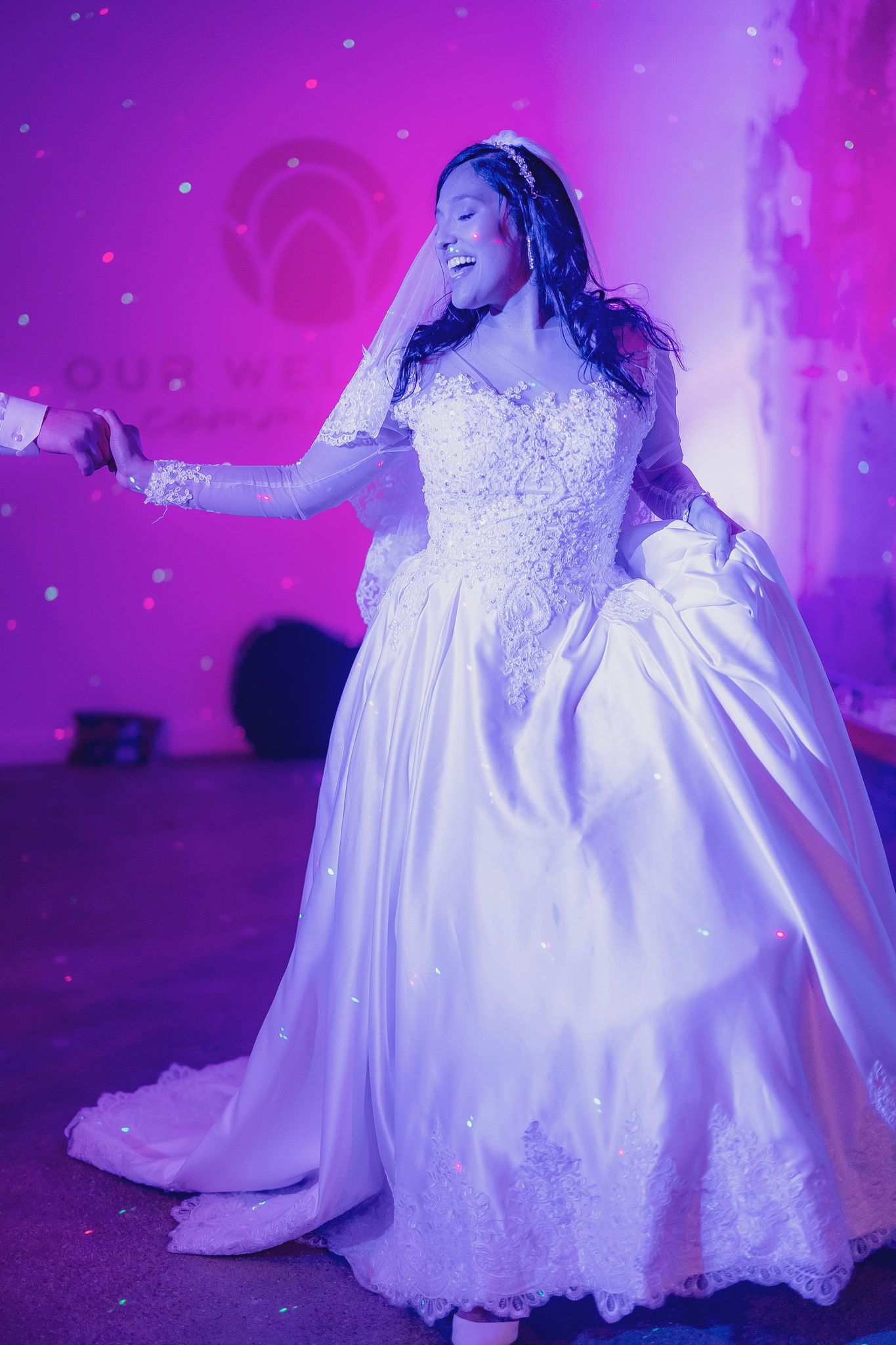 The bride, Selena, dances with her husband