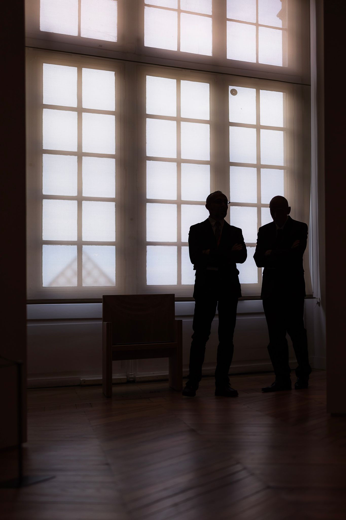 Two guards protect a Louvre exhibit