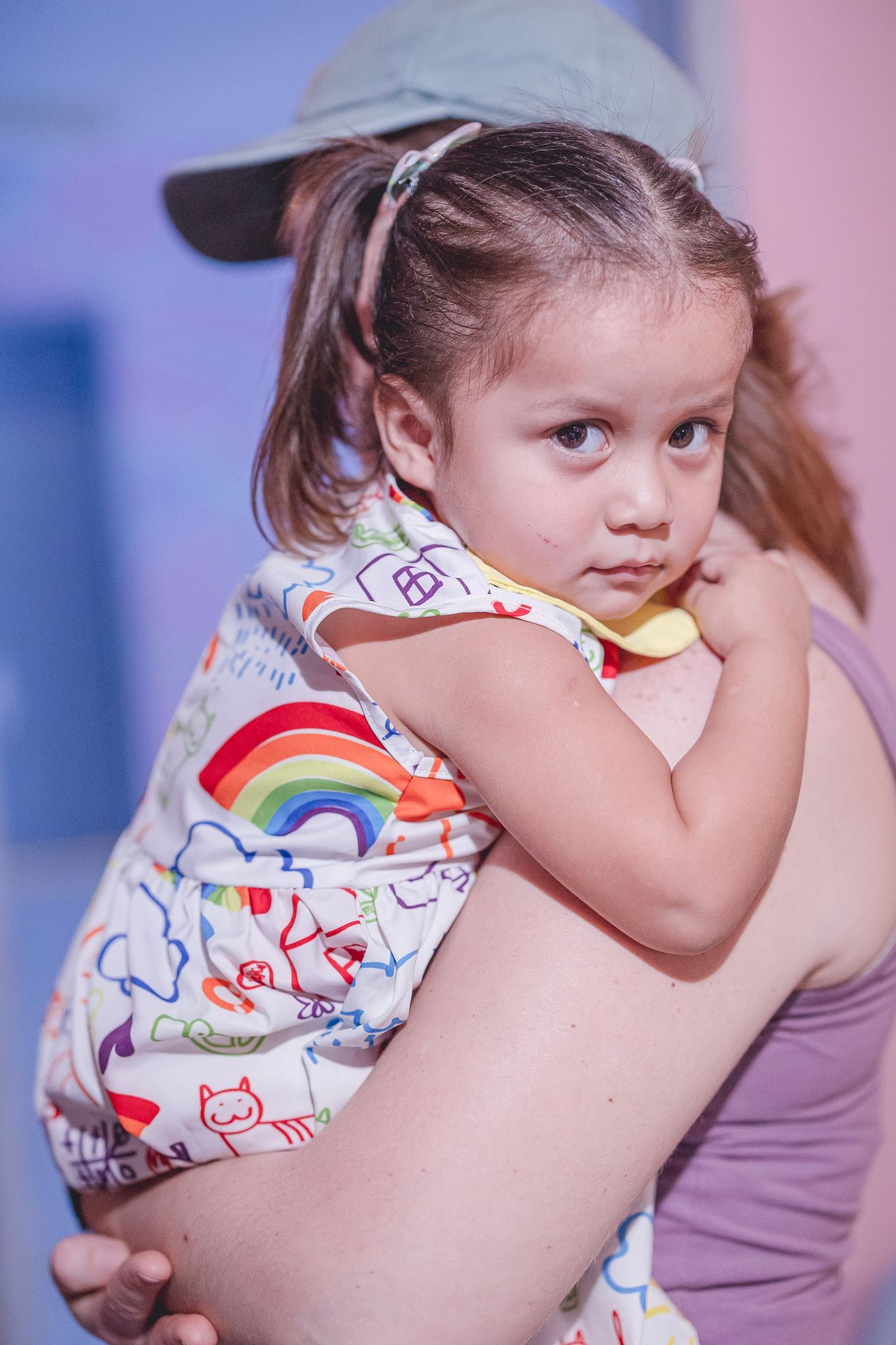 A young Mexican orphan being held by a volunteer