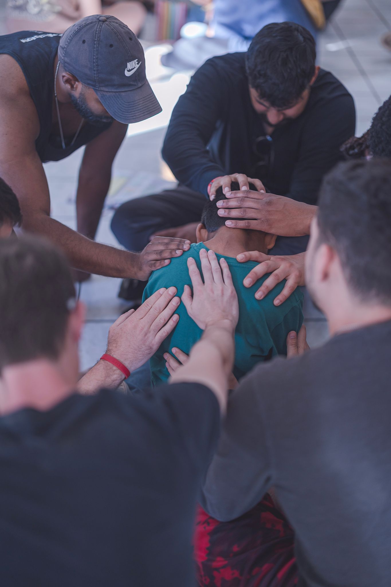 A boy is prayed for by volunteers an orphanage. His hope was restored after being reminded of the love he can experience every day